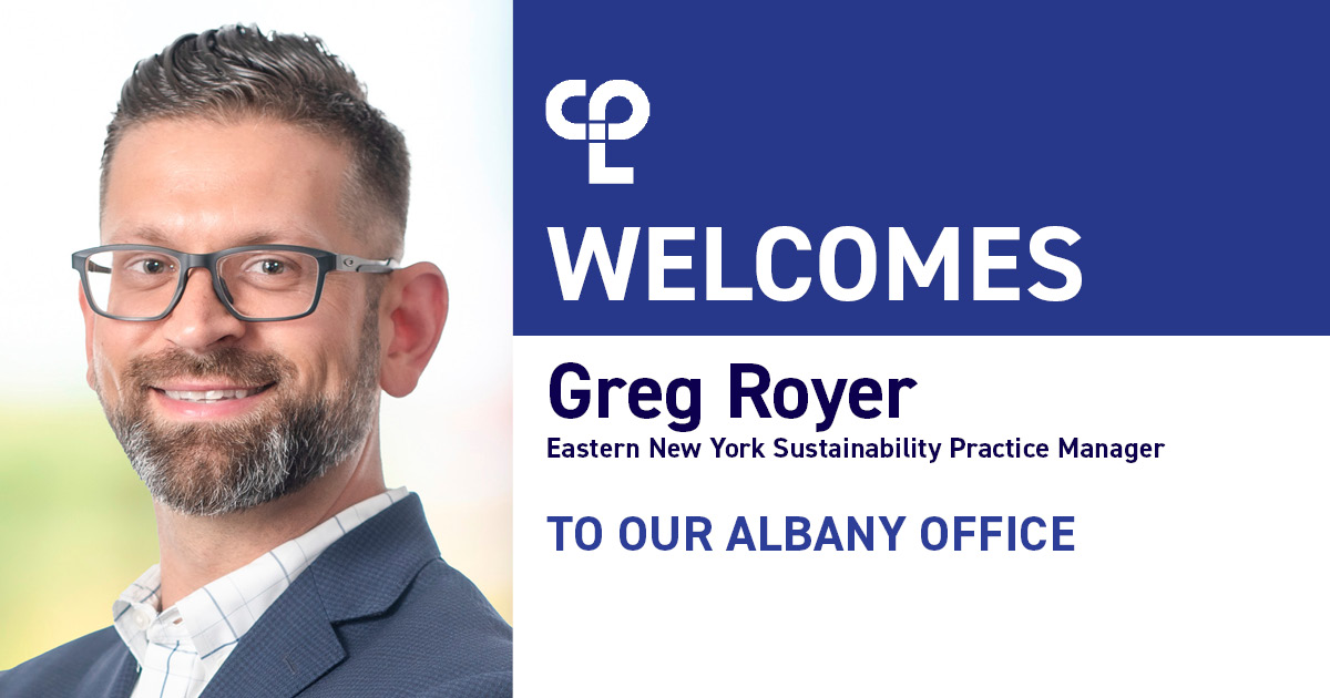 Image is a graphic. On the left is a white man who is smiling with glasses and short gray hair. He has a gray beard and is wearing a blue suit with a white button up that has stripes on it. The right side of the graphic reads "CPL Welcomes Greg Royer Eastern NY Sustainability Practice Manager To Our Albany Office"