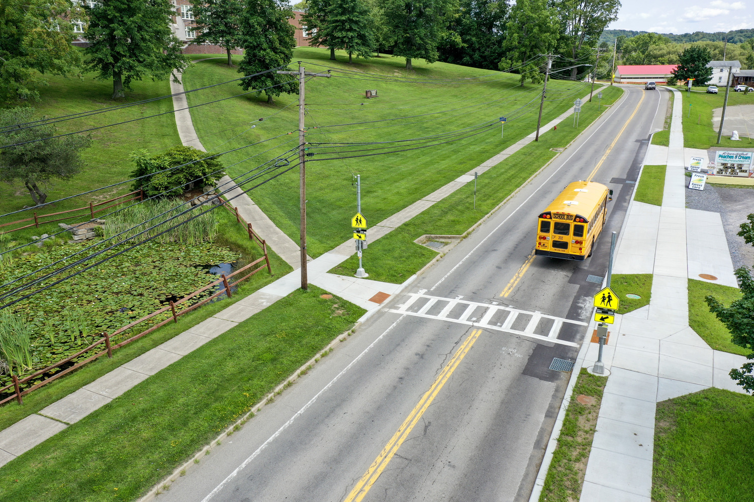 Town of Randolph Pedestrian Safety exterior image of street with a crosswalk and a school bus