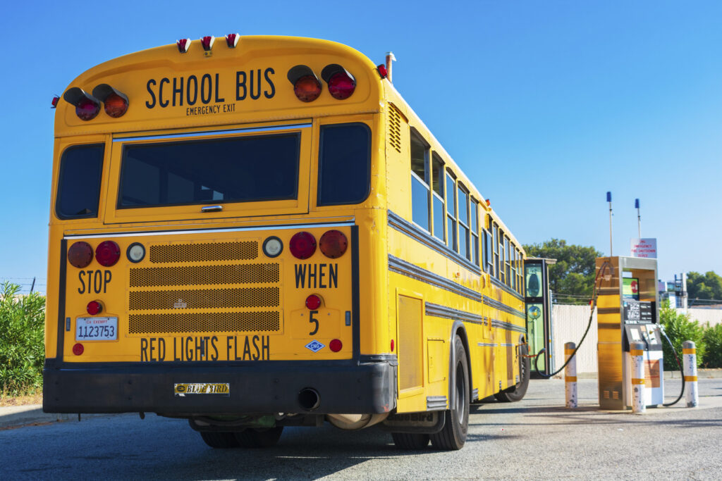 Yellow school bus low emissions NGV school bus refuel