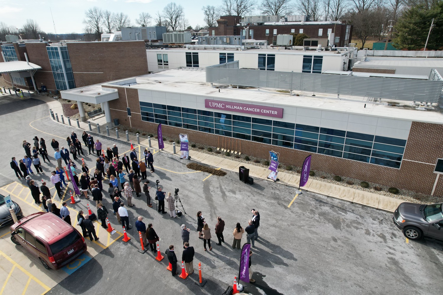 A group of people gathered for the groundbreaking of UPMC Hillman Cancer Center Radiology Oncology. The building reads "UPMC Medical Center"