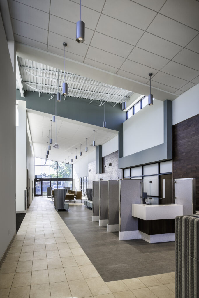 MPA_2021_001_N8 copy Veteran Affairs Community Outreach Clinic lobby/waiting area with tall booths, brick walls, and tile floors
