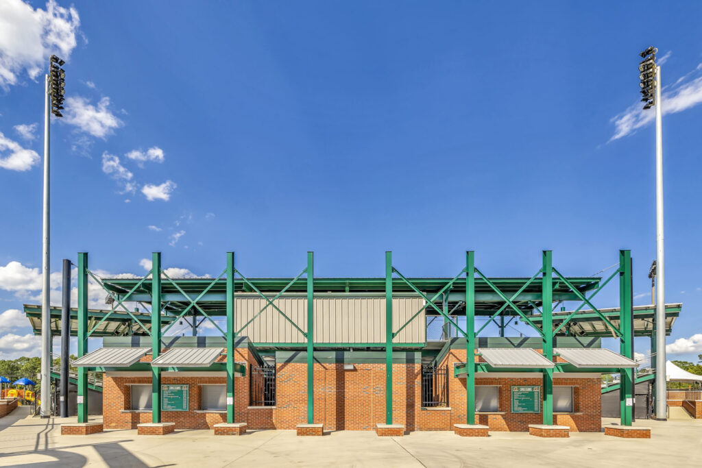 A building at McCrary Park, with brick and hunter green structural steel.