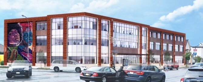 A rendering of the new Kensington-Bailey Health and Community center on Buffalo's East Side. The building is a brick facility with a colorful mural on the side, and traffic on the street in front.