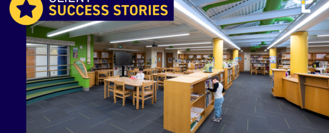 A modern school library at Allegany-Limestone Central School District, featuring bright lighting, wooden bookshelves, and students actively engaging with books.