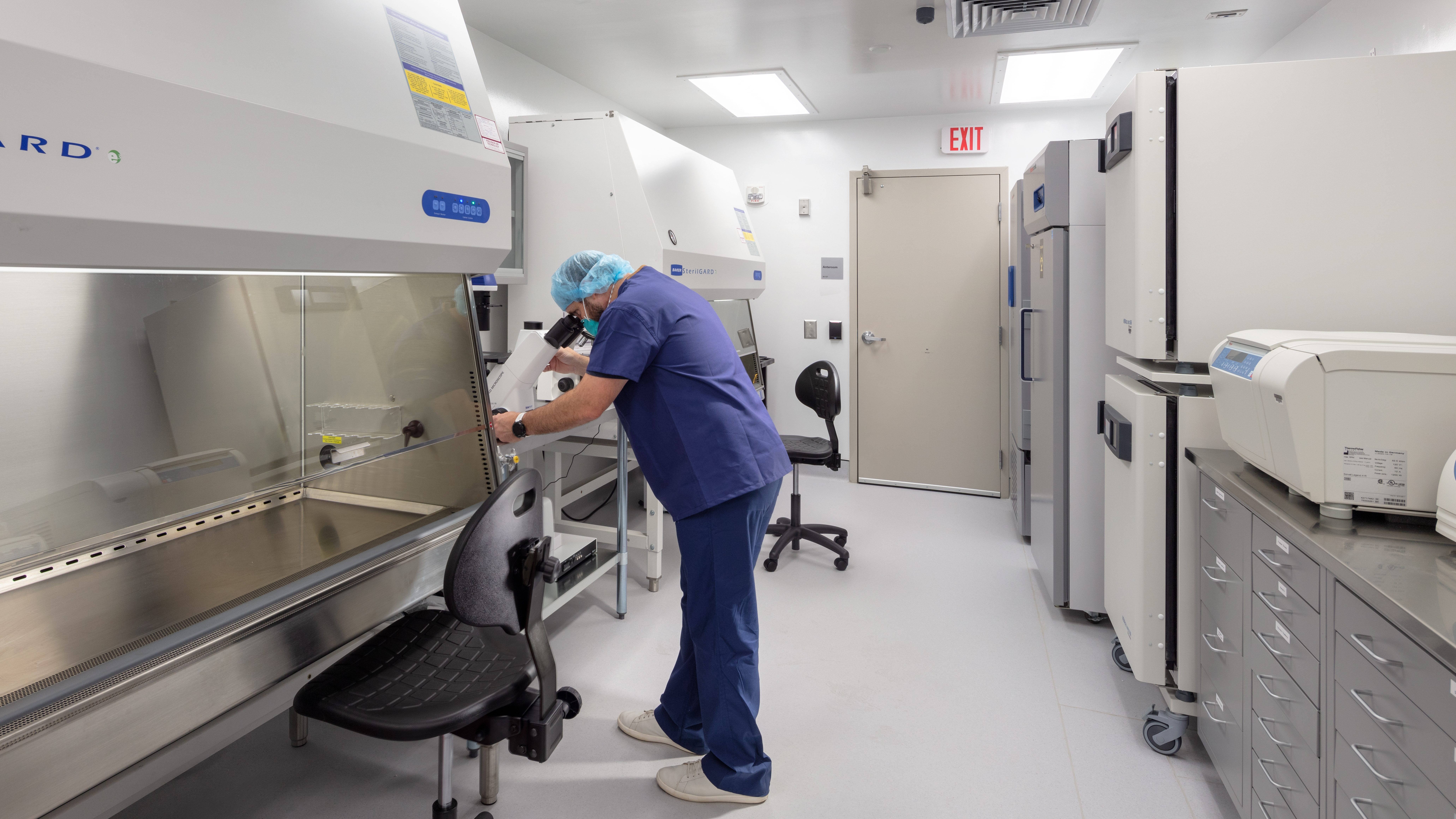 Scientist in protective gear in high-containment lab
