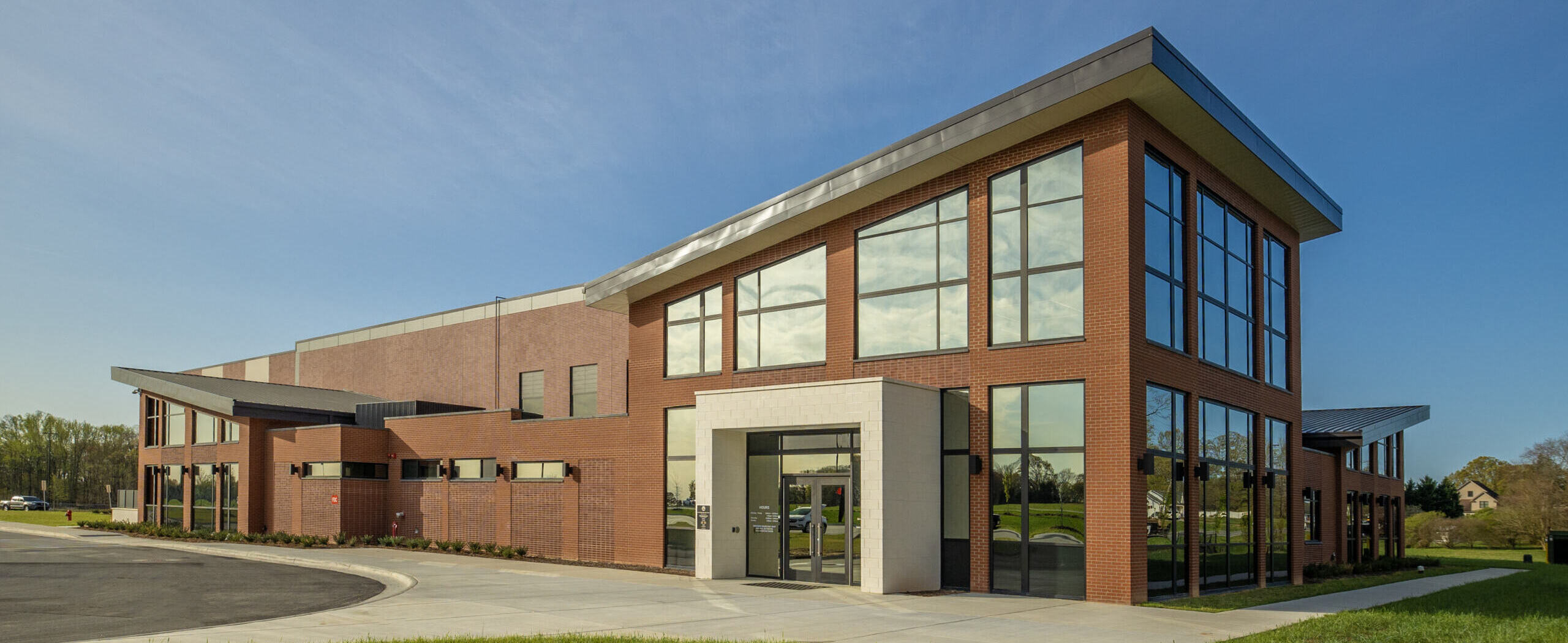An exterior view from ground level of the Kernersville Rec Center and immediate surrounding area.