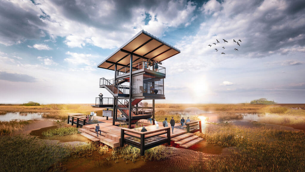 Modern, multi-level observation deck in a marshland setting, with people enjoying the sunset. Birds fly overhead against a dynamic, cloudy sky.