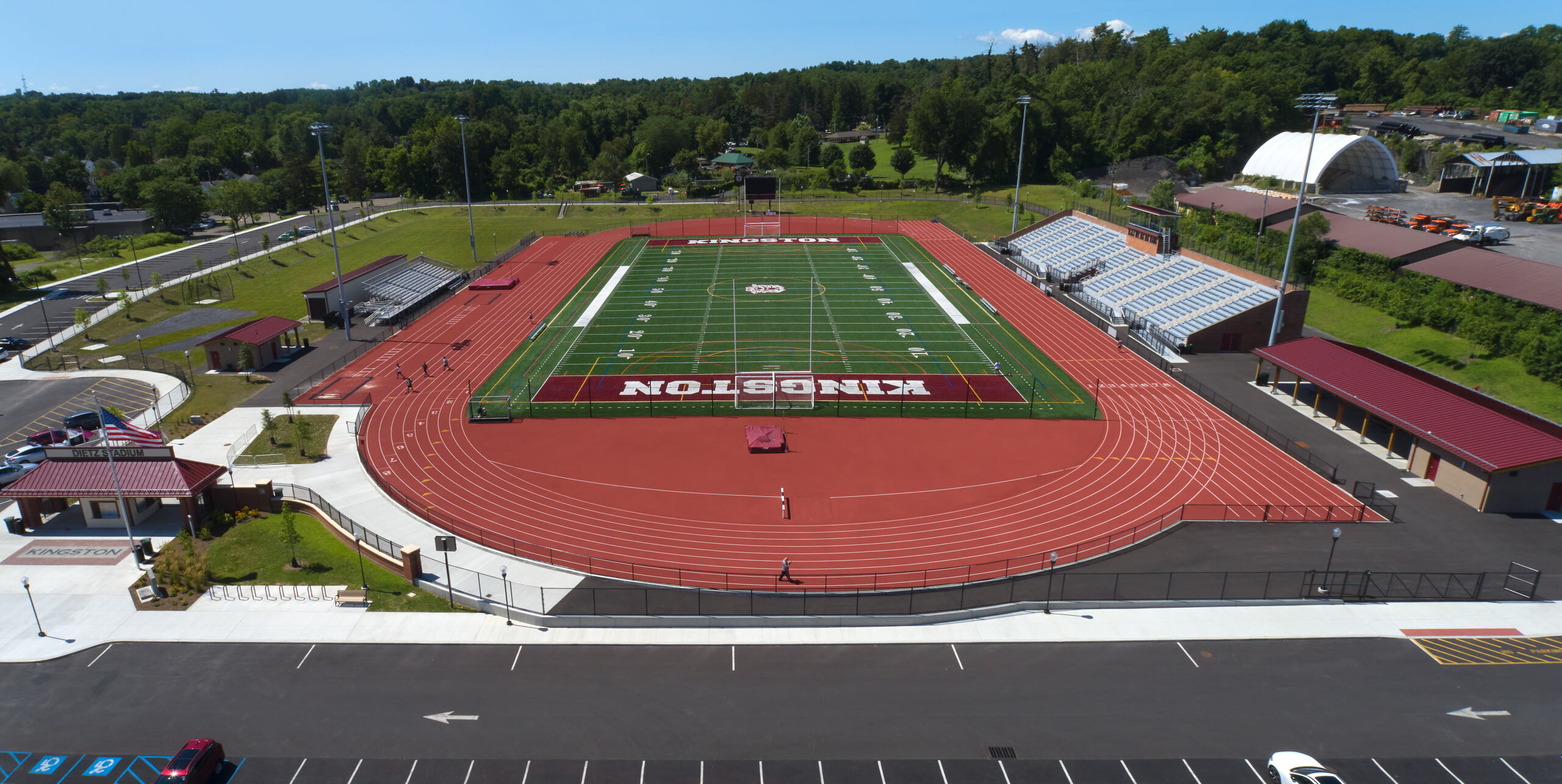 Deitz Stadium Aerial view of the Deitz Stadium field with stands and surrounding trees and buildings on a sunny day.