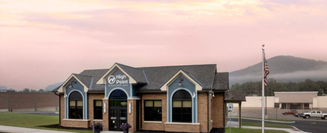 The front of the High Point FCU Bradford Branch at sunset.