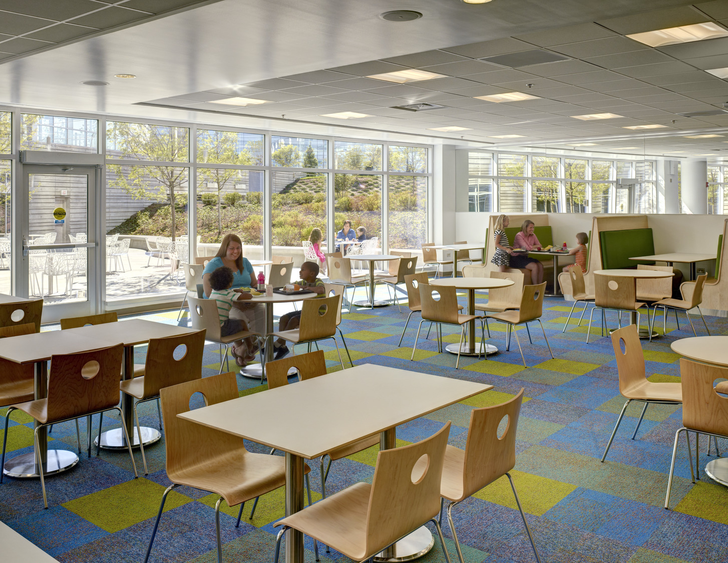 AND_2012_043_N2_medium A woman sits at a table in a cafeteria style room at Nationwide Children's Hospital