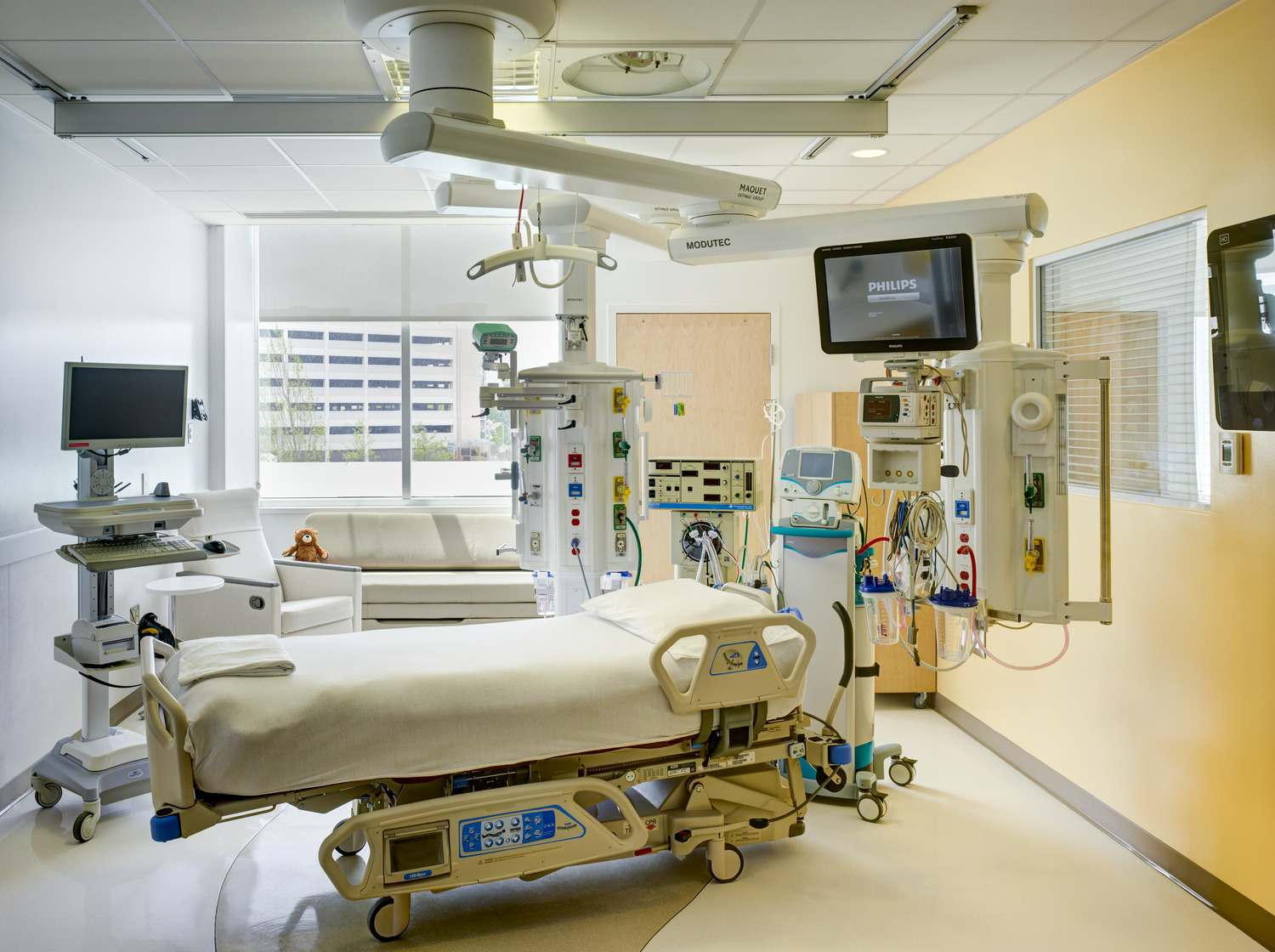 Another patient room in the hospital with a medical bed in the center of the room surrounded by various medical equipment at Nationwide Children's Hospital