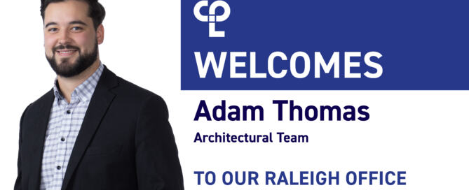 A man in a blazer stands smiling. Text reads "Welcomes Adam Thomas, Architectural Team, to our Raleigh Office" on a blue and white background.