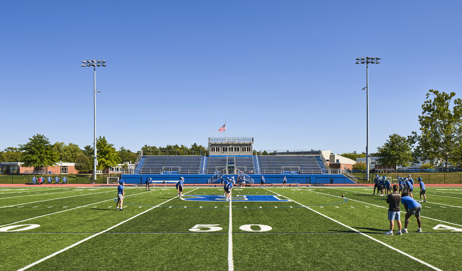 R19_14206_05_RondoutAthletics_N2_medium A football team practicing in blue jerseys on the renovated Rondout Valley CSD athletic complex.