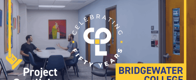 Alt text: "Two people converse at a table in a brightly lit room. Walls feature colorful artwork. Overlaid text reads 'Project Spotlight, Celebrating Fifty Years, Bridgewater College.'" This is the thumbnail for a video spotlighting our Higher Education team's long term campus planning partnership with Bridgewater College.