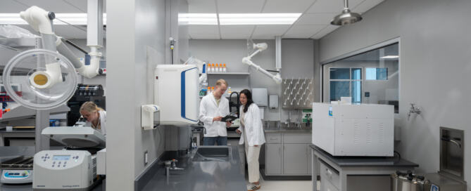 3 lab technicians work together with equipment in an ISA lab