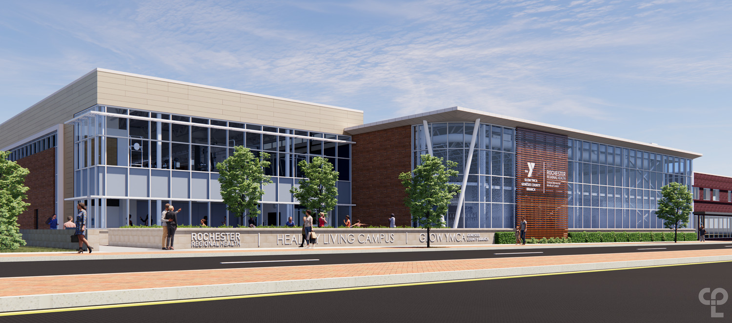 Modern building with glass facade labeled "Rochester Regional Health | Healthy Living Campus." People walk along a sunny sidewalk with trees. This is the GLOW YMCA Final Renders