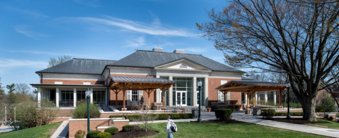 Renovated Ford Dining Hall at Mercersburg Academy featuring brick architecture, tall windows, and landscaped campus grounds as part of a campus dining hall renovation.