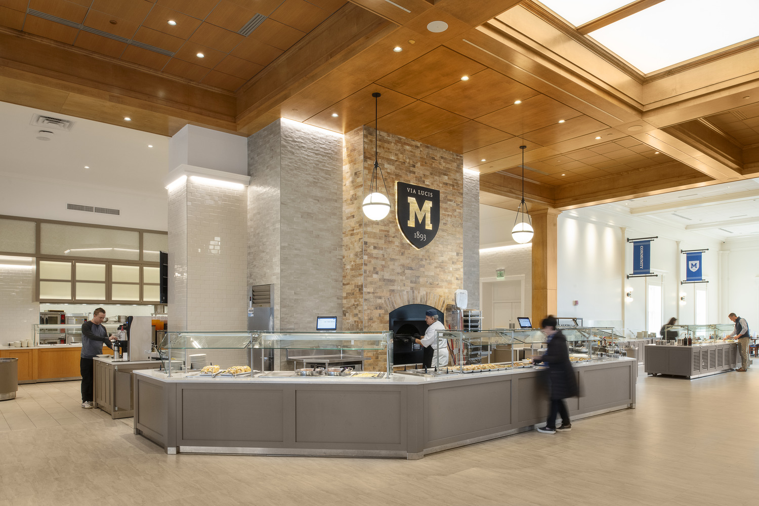 Students and visitors use food service stations in the renovated Ford Dining Hall, part of a campus dining hall renovation at Mercersburg Academy.